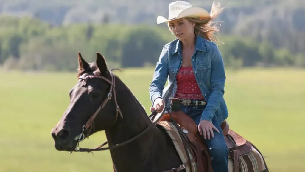Amy Fleming riding Spartan, her beloved horse, through the picturesque Alberta mountains in Heartland.
