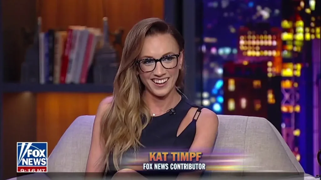 Kat Timpf laughing on set.